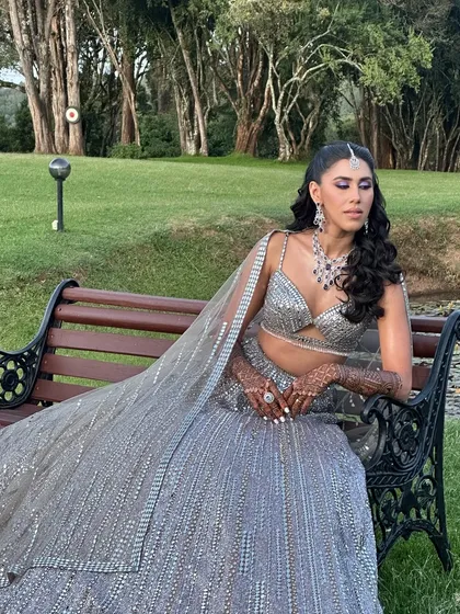 My beauty Reana looking stunning for her sangeet. The purple eye makeup perfectly complements her silver lehenga, creating a modern and chic look.