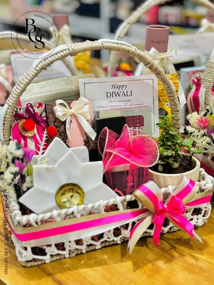 This charming Diwali basket combines a live plant, a marble lotus diya, and other festive treats. The pink and white theme gives it a fresh and modern feel, perfect for personal or corporate gifting.