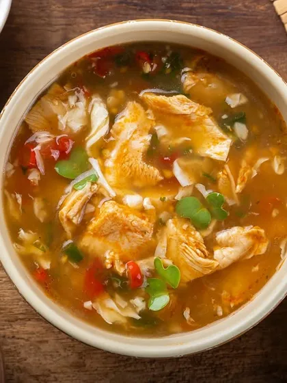 A hot and sour chicken soup, styled with fresh and dried chilies, from my YouMee archive.