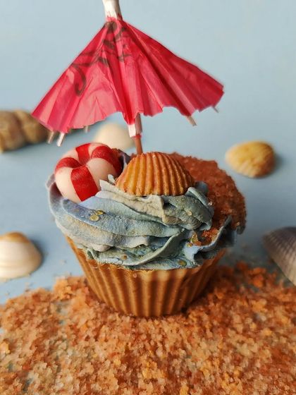 This beach-themed cupcake soap was one of my most creative challenges. A client wanted quirky favors for her beach wedding. The cupcake has soap shells and a life-saving boat on top, complete with a cocktail umbrella.