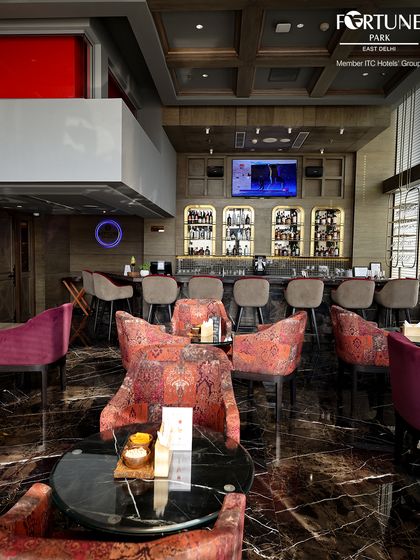 The spacious and modern interior of Neptune, with its dark marble floors and plush seating, is designed for ultimate comfort and style.