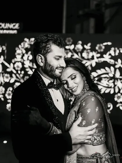 "Home is where you are." This black and white portrait from a reception is full of emotion, capturing a quiet, comforting embrace.