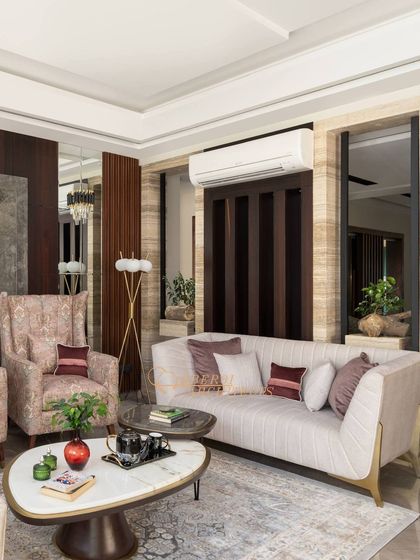 The combination of a floor lamp, natural light, and reflective surfaces makes this living room feel bright and welcoming.