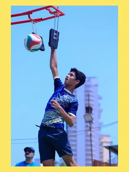 Perfecting the arm swing and contact during a spike training session. This is where power and precision are born.