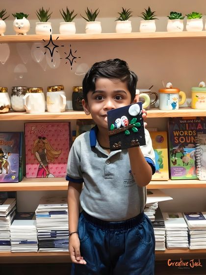 A proud young boy shows off the clay art piece he made during a preschool field trip to my Belapur studio. It's amazing to see such big ideas come from little hands.