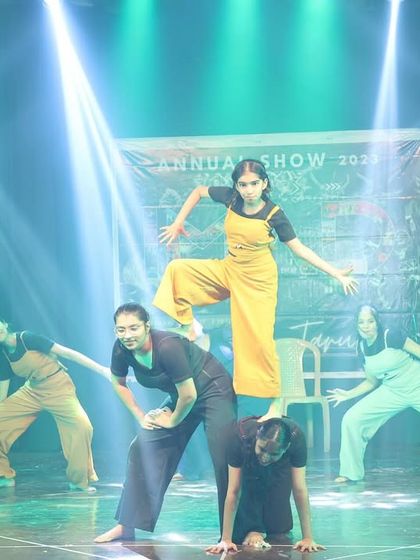 A lift from our contemporary act, showcasing the strength and balance of our dancers as they create a powerful visual metaphor.