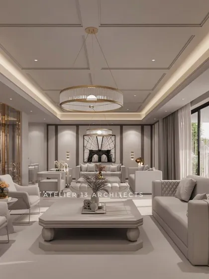 A preview of our design for a luxury apartment at DLF Camellias, featuring a formal living area in a monochromatic white and grey palette. The space is detailed with quilted sofas, reflective metal screens, and a carefully planned coffered ceiling with ambient lighting.