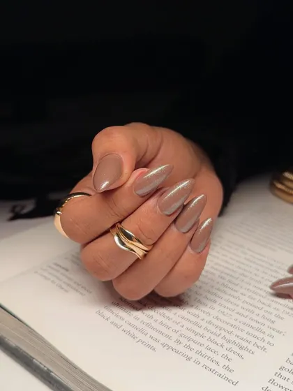 A close-up of our mocha mousse shade. This image shows the beautiful, coffee-inspired neutral color on perfectly shaped almond nails.
