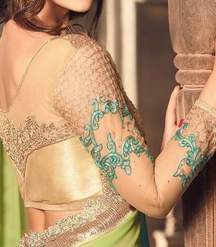 A beautiful blouse with sheer sleeves featuring delicate turquoise embroidery. We can add custom embroidery to your blouse to match your saree or lehenga perfectly.