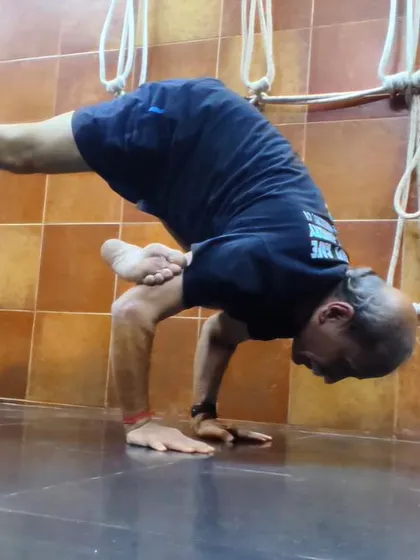 Parsva Bakasana, the Side Crow Pose. This arm balance requires a combination of twisting action, core engagement, and upper body strength.