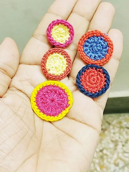 A throwback to the personalized rakhis I make for my brothers every year. These colorful, circular designs are just a few examples of my creations.