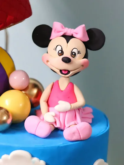 A close-up of the hand-sculpted Minnie Mouse figurine.