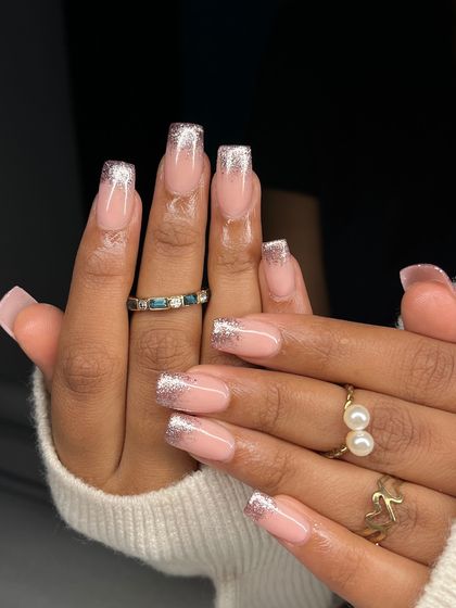 The full view of the rose gold glitter fade French manicure. The square shape gives this classic look a modern and bold edge.