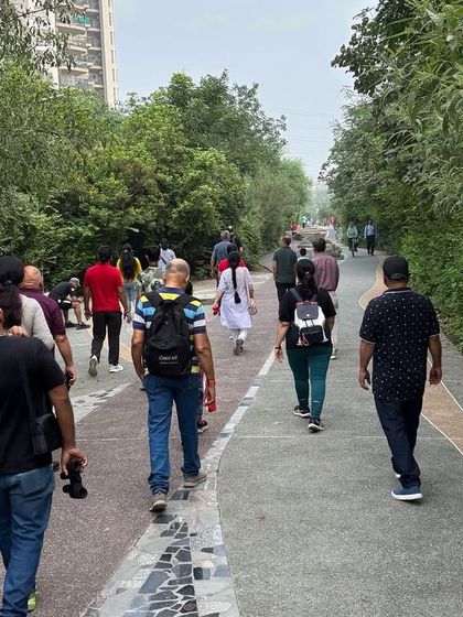 Citizens walk along the Badshahpur Forest Corridor, a 5.6 km green lifeline restored by us that reconnects people with nature.