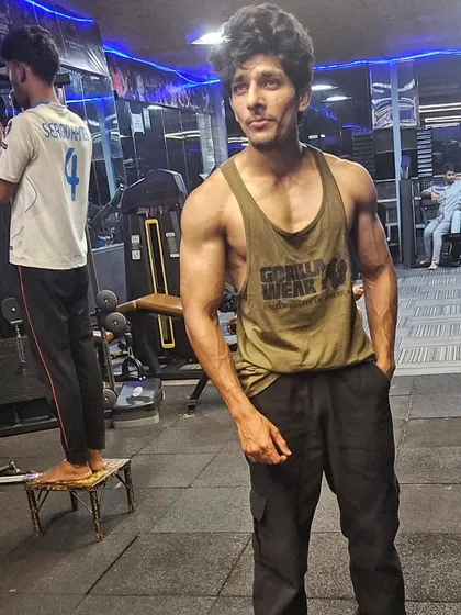 In the zone at the gym. A consistent workout routine is essential for building the strength that powers our martial arts techniques.