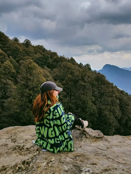 A scenic shot from Jibhi, taken on the Oppo Find X5 Series. This image combines fashion and travel, showing how a product can be featured within a stunning, shareable landscape photo.