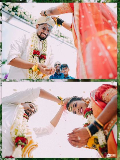 The Talambralu or rice showering ceremony, captured from a creative low angle to emphasize the joy of the moment.