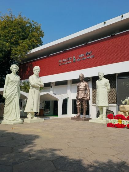 The entrance to the Art Gallery at Lalit Kala Akademi, lined with monumental sculptures.