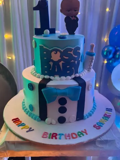 The theme extends to every detail, including the cake. This two-tier Boss Baby cake perfectly matches the decor we set up for Samarth's first birthday party.