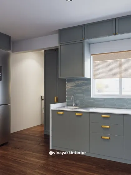 Natural light is a key ingredient in any kitchen. This angle highlights the window, which brightens the sink area, and shows the clean lines of the cabinetry and the beautiful texture of the backsplash tiles.