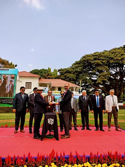 Presenting the Champion Trainer Trophy.