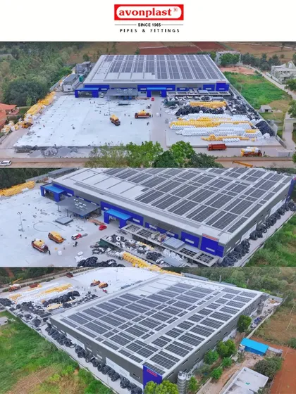 A wide aerial shot of the Avonplast factory, showing the large-scale rooftop solar installation and the extensive yard with materials.