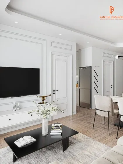 A clean and classic look with white wall molding, a simple black coffee table, and light wood flooring. This design is all about understated elegance.