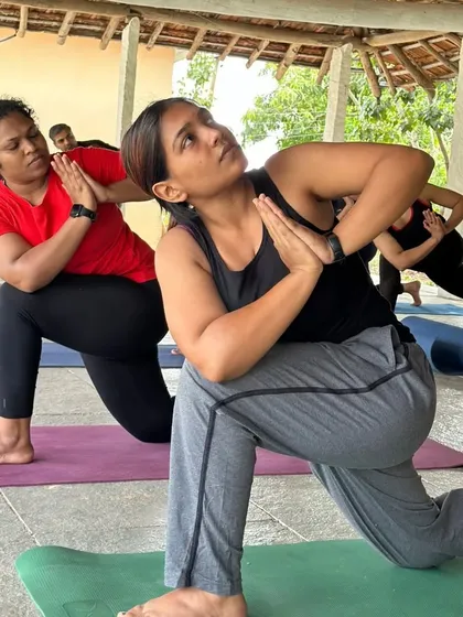 This is what our community looks like in action. During a retreat, students of all levels practice together, supporting and learning from one another. It's not about perfect poses, but about shared energy and collective growth in a beautiful, natural setting.