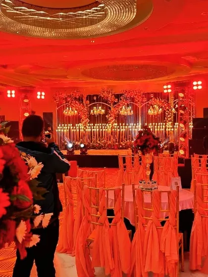 This view shows our team setting up the lighting and sound trusses for a large-scale sangeet. We manage the technical production to ensure every performance looks and sounds incredible.