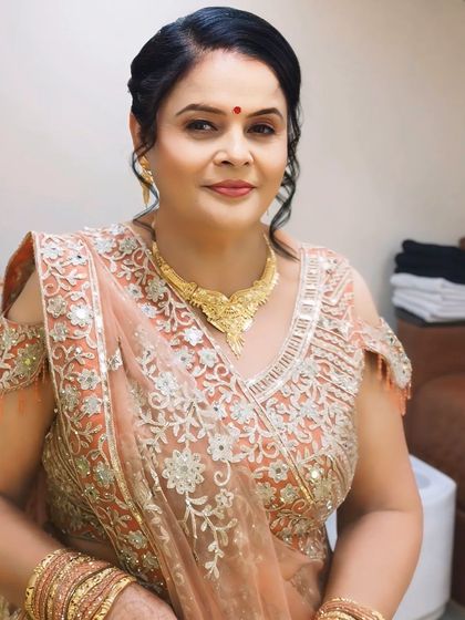 A beautiful portrait of the client, highlighting her graceful smile and the subtle, age-appropriate makeup.