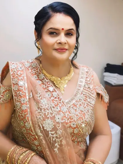 A beautiful portrait of the client, highlighting her graceful smile and the subtle, age-appropriate makeup.