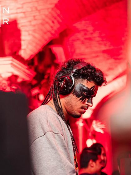 A shot from behind the console during my Halloween set in Indore. The red lighting and my mask created a perfectly spooky mood for the night.