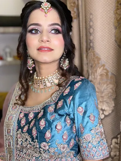 My beautiful client Aafreen, all dolled up for her brother's reception. The soft glam makeup perfectly complements her beautiful and intricate outfit.