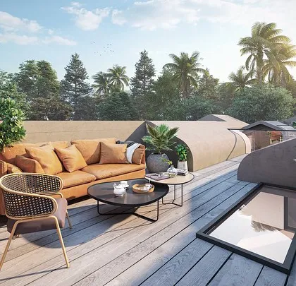 We transform rooftops into functional and beautiful outdoor living areas, like this terrace in our Vagator Villas project. This space provides a private escape with panoramic views, featuring a comfortable lounge area set against a backdrop of Goan palm trees and sky.