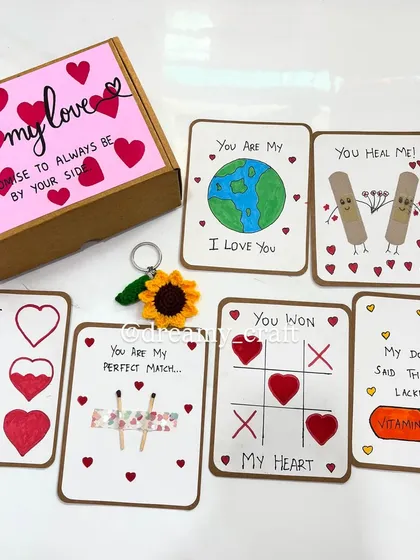 A little box of love filled with cute, hand-drawn cards. Each card has a playful and heartfelt message, like "You are my perfect match" or "You won my heart".