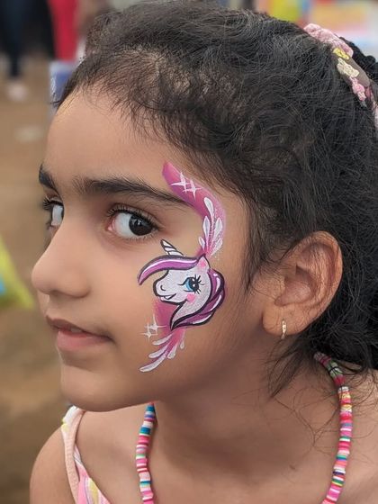 A beautiful unicorn design with pink accents and feathery details, a truly magical look.