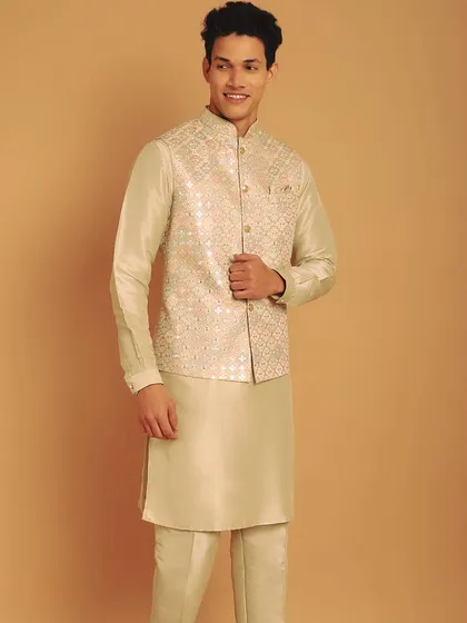 This beige kurta pajama set with an embroidered jacket is a timeless choice for any festivity. My in-house tailoring ensures the garment is made to your size, not just altered.
