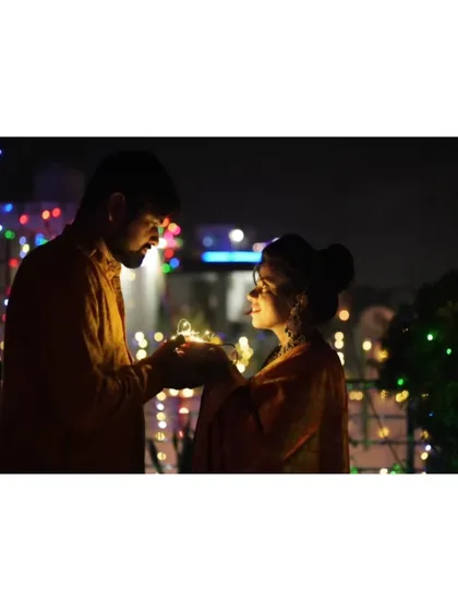 A slightly different angle of the romantic Diwali couple's shoot, capturing their connection.