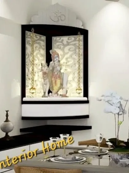 A closer view of the wall-mounted corner mandir, showing the detailed craftsmanship and the serene ambiance created by the spotlight.