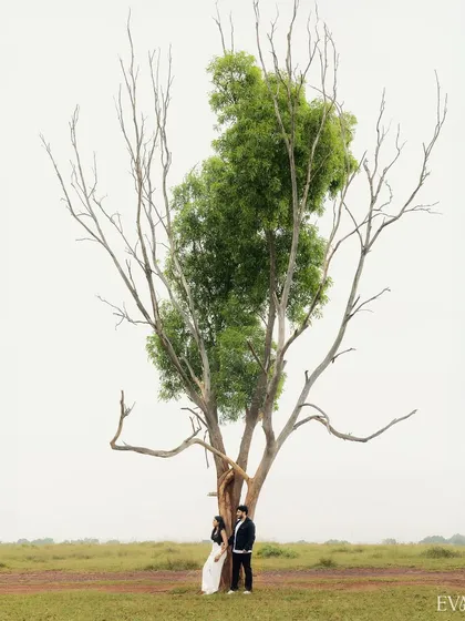 We see the world through a cinematic lens. This artistic pre-wedding portrait, with its minimalist composition against a vast landscape, shows our ability to create powerful, movie-poster-worthy images that are both epic and intimate.