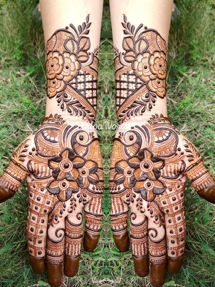 A bold floral design with a mix of different flowers and patterns, creating a lush, garden-like effect.