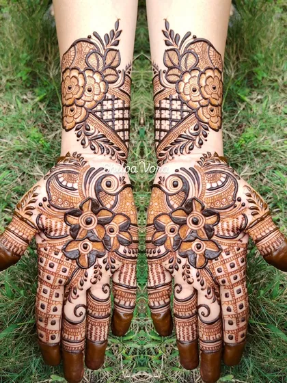 A bold floral design with a mix of different flowers and patterns, creating a lush, garden-like effect.