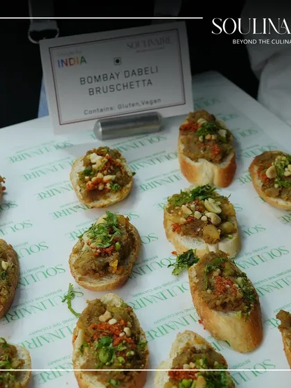 A creative fusion dish: Bombay Dabeli Bruschetta. This appetizer, served at the Google for India event, perfectly represents our innovative blend of Indian street food and global formats.