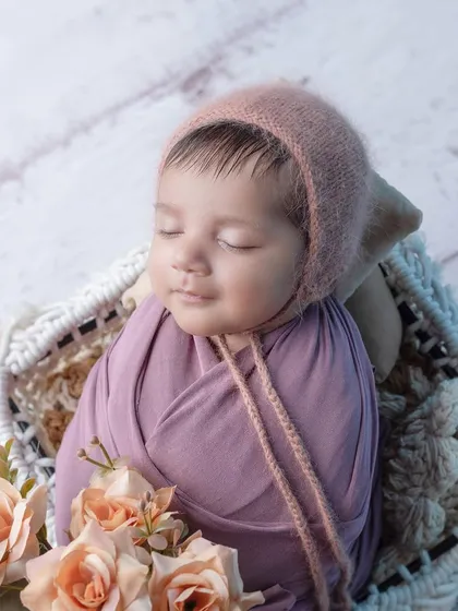 A gentle smile on this sleeping baby's face is just the sweetest thing.