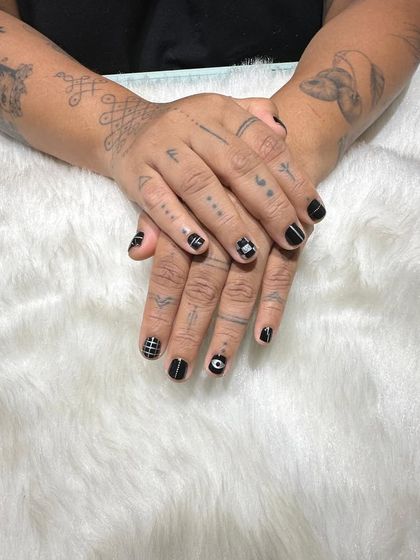 A wider view showing how the nail art complements the client's overall aesthetic. It's all about creating a look that feels authentic to you.