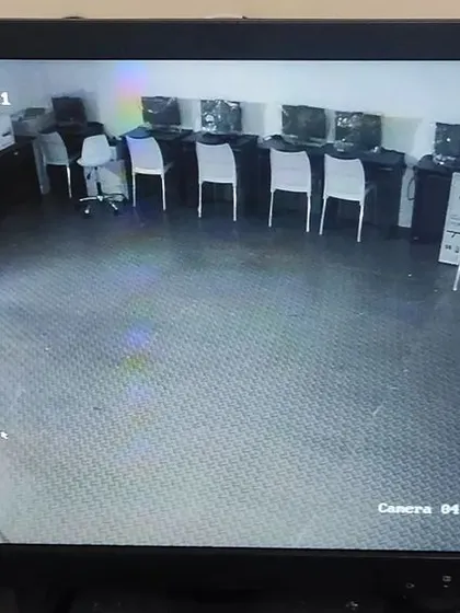 I also set up surveillance for larger spaces like this computer lab in a school. A single camera can monitor the entire room, ensuring the security of the equipment.