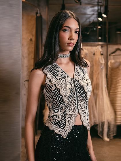 A closer view of the pearl-embellished waistcoat, a piece that adds a touch of elegance and sparkle to any occasion.