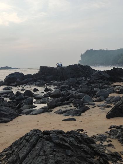 The rocky shoreline of a secluded beach we discover during our trek.