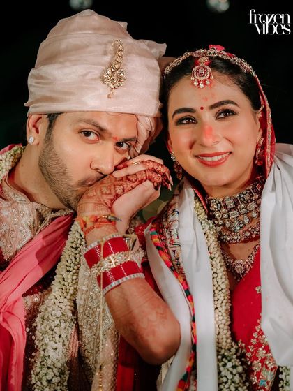 A playful and intimate moment right after the ceremony. The groom kissing the bride's hand is a classic gesture of love that I always look to capture.