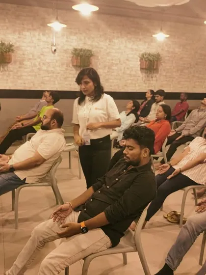 Finding moments of calm during a busy workday is essential for mental health and productivity. Here, I am guiding a corporate group through a chair yoga and meditation session, a simple practice designed to release tension and restore focus right at the office.